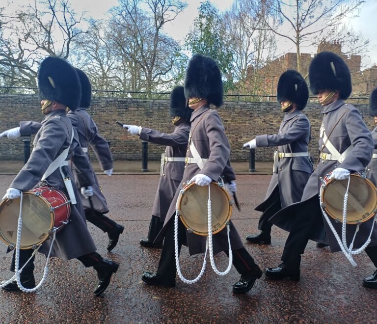 Guards in bearskin hats marching at the Changing of the Guard