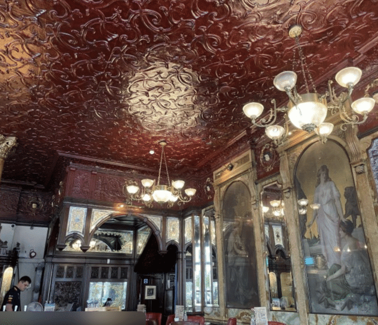 Ornate pressed-tin ceiling in a historic London pub