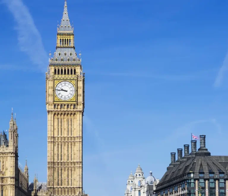 Big Ben and the Houses of Parliament under a blue sky