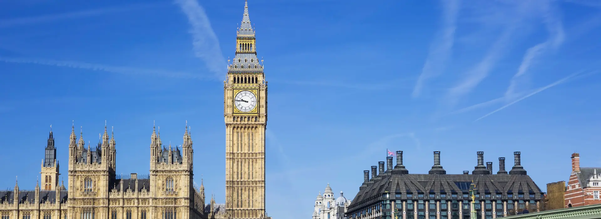 Big Ben and the Houses of Parliament under a blue sky