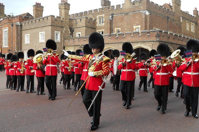 Royal guards band marching in red tunics