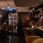 Dimly lit historic wine bar interior in London