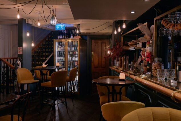 Dimly lit historic wine bar interior in London