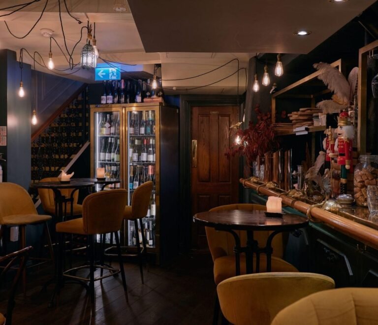 Dimly lit historic wine bar interior in London