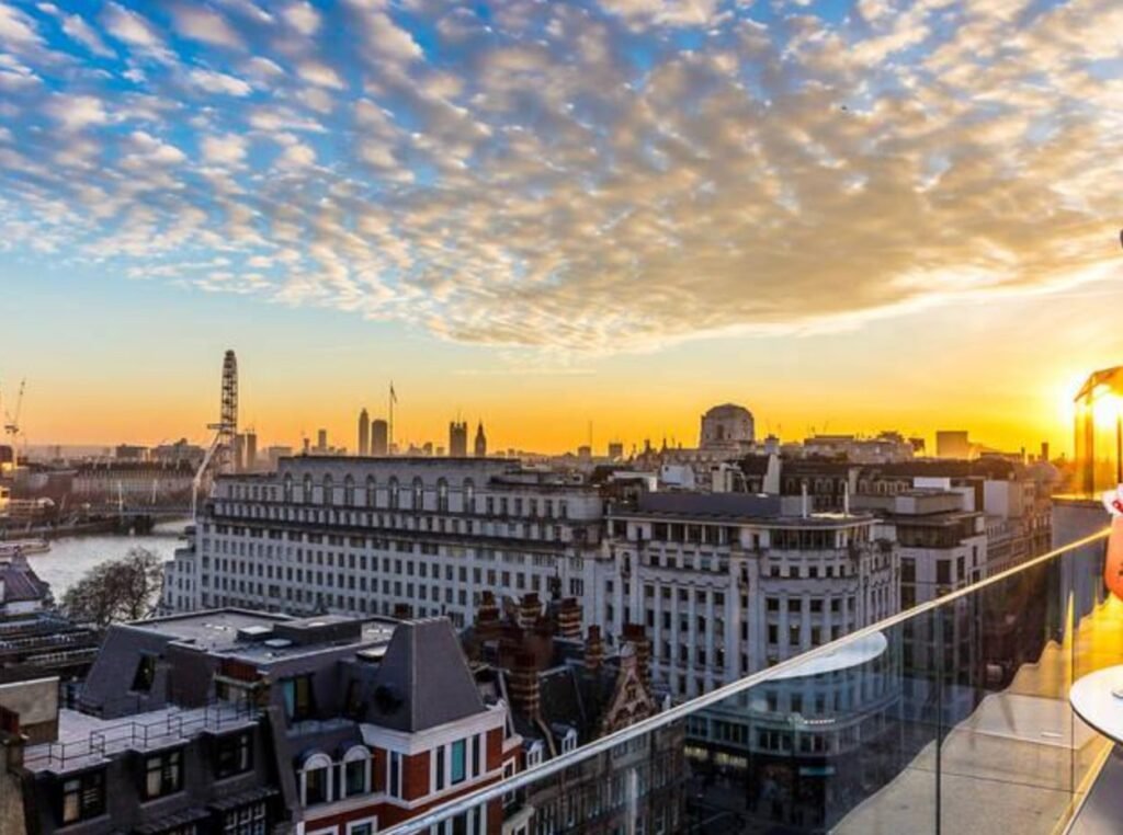 Sunset over the London skyline from a rooftop