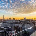 Sunset over the London skyline from a rooftop