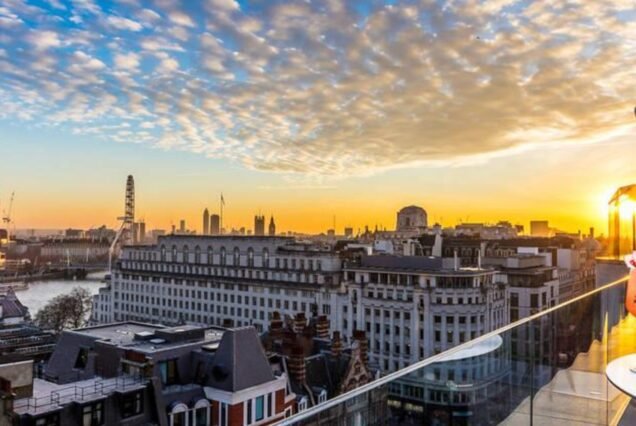 Sunset over the London skyline from a rooftop