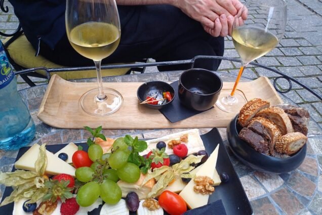 White wine with a cheese and fruit board