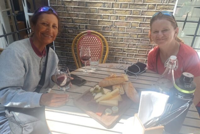 Guests sharing wine and cheese at a London wine bar