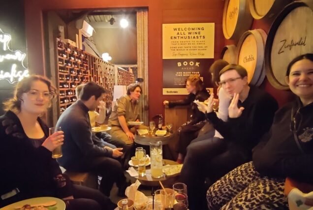 Guests enjoying wine at a London wine bar